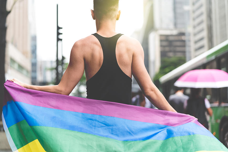 Gay Man Holding Rainbow Flag Photograph by FG Trade