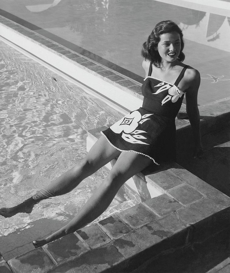Gene Tierney Sitting Poolside Photograph by John Swope