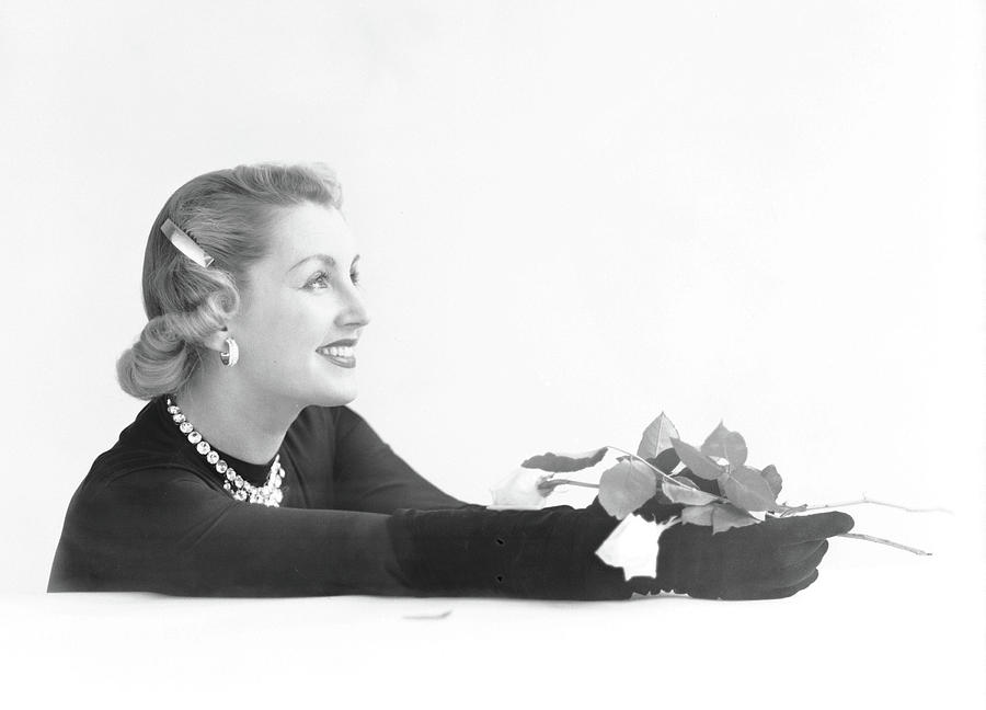 Genevieve Fath Holding A Rose Photograph by Richard Rutledge