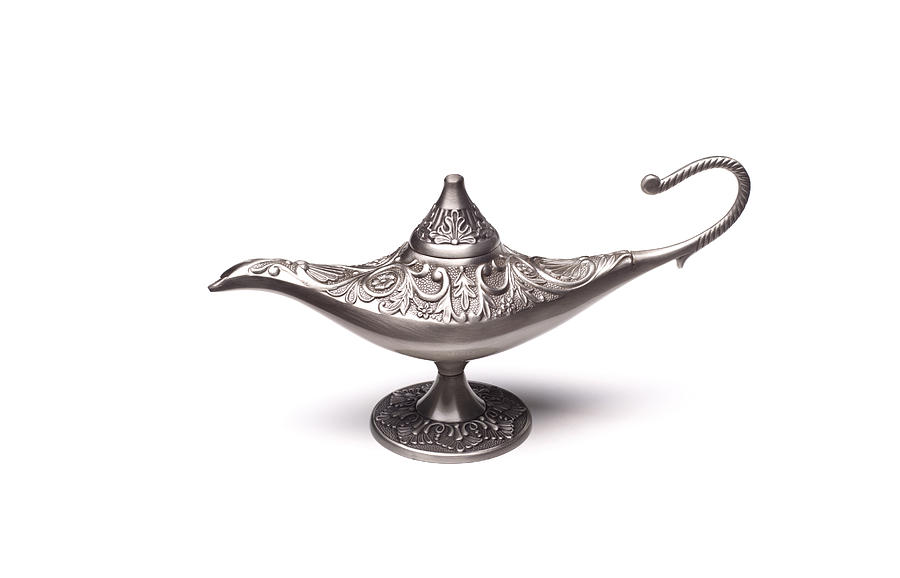 Genies aladdin lamp with white background Photograph by Peter Dazeley