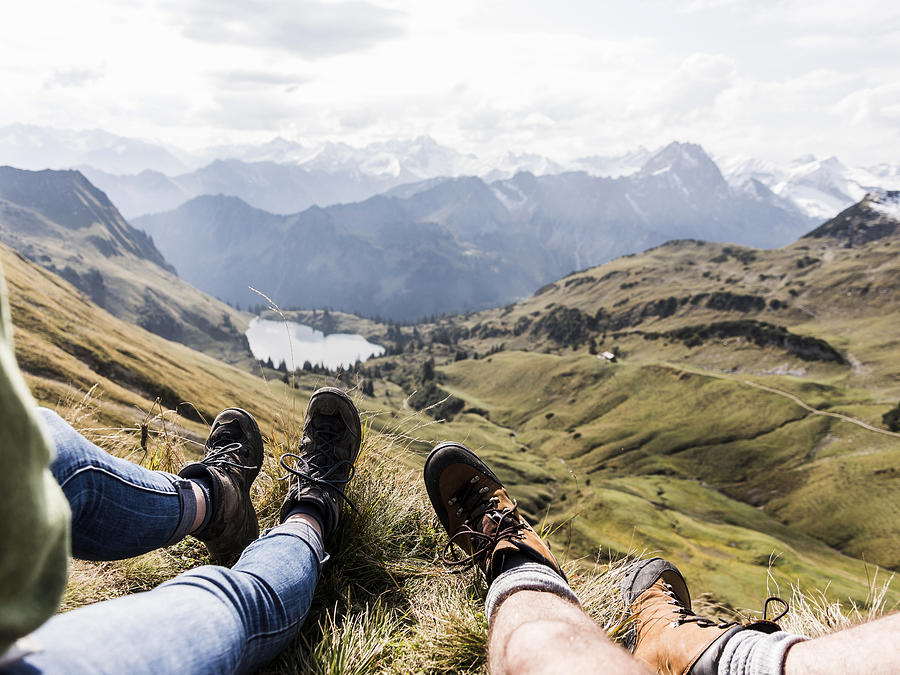 Germany, Bavaria, Oberstdorf, legs of two hikers resting in alpine scenery Photograph by Westend61