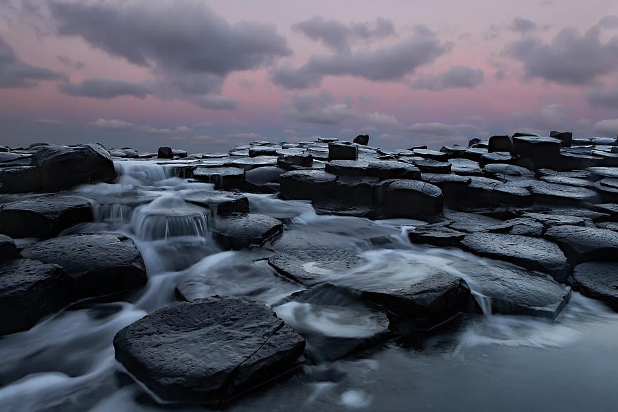 Giants Causeway With A Pink Sunrise Photograph by Getty Images