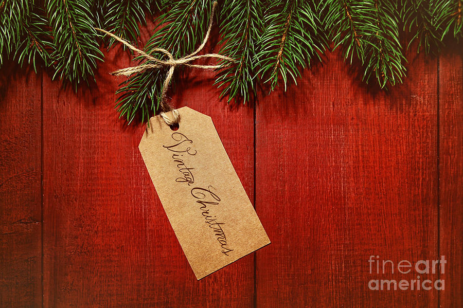 Christmas Photograph - Gift tag on red wood background by Sandra Cunningham