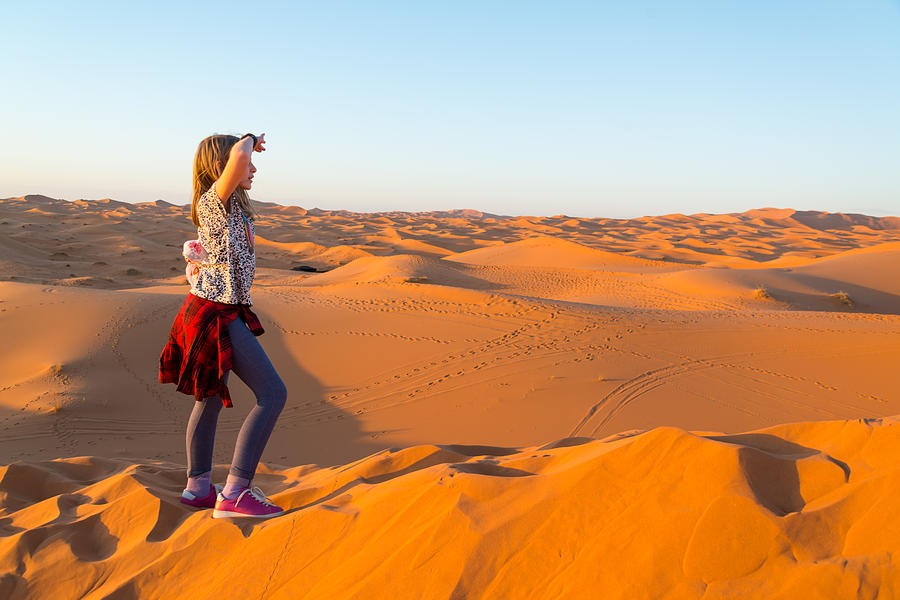 Girl exploring Sahara desert near Merzouga, Morocco Photograph by Stefan Cristian Cioata