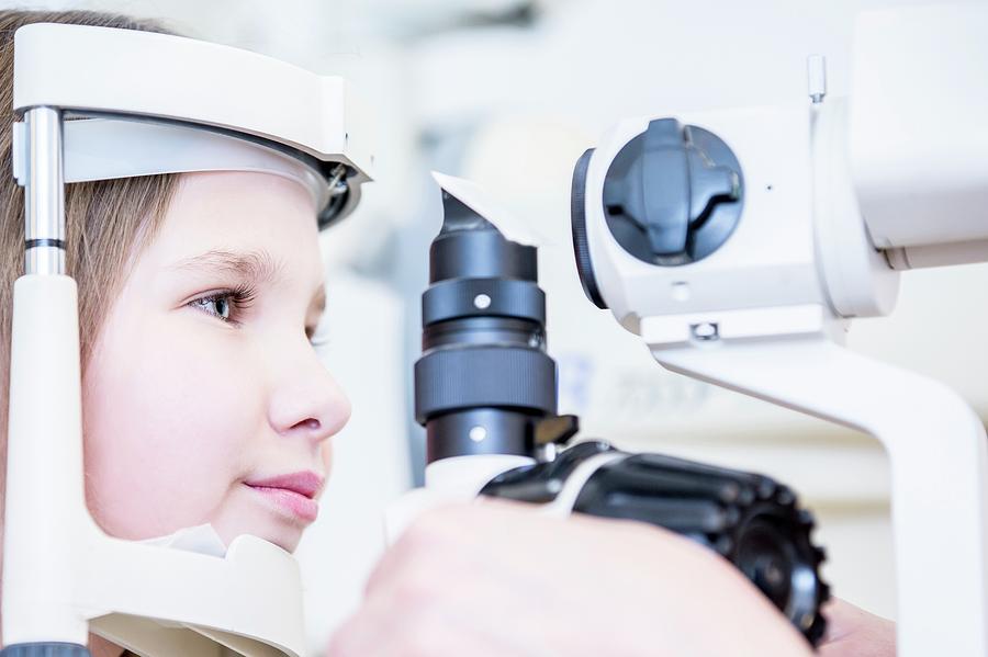 Girl Having Eye Examination Photograph by Science Photo Library