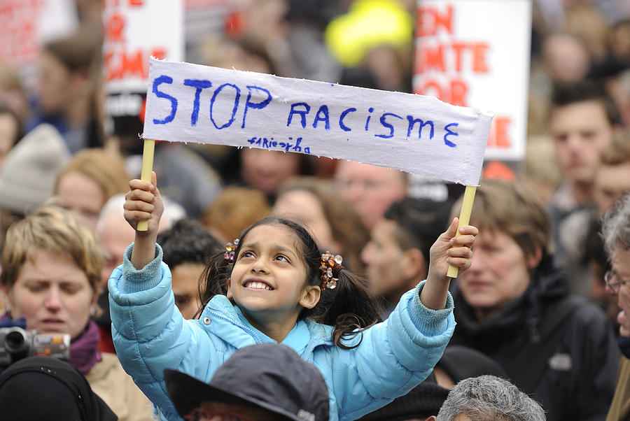 Girl holding a banner in an anti-racism protest Photograph by Vliet