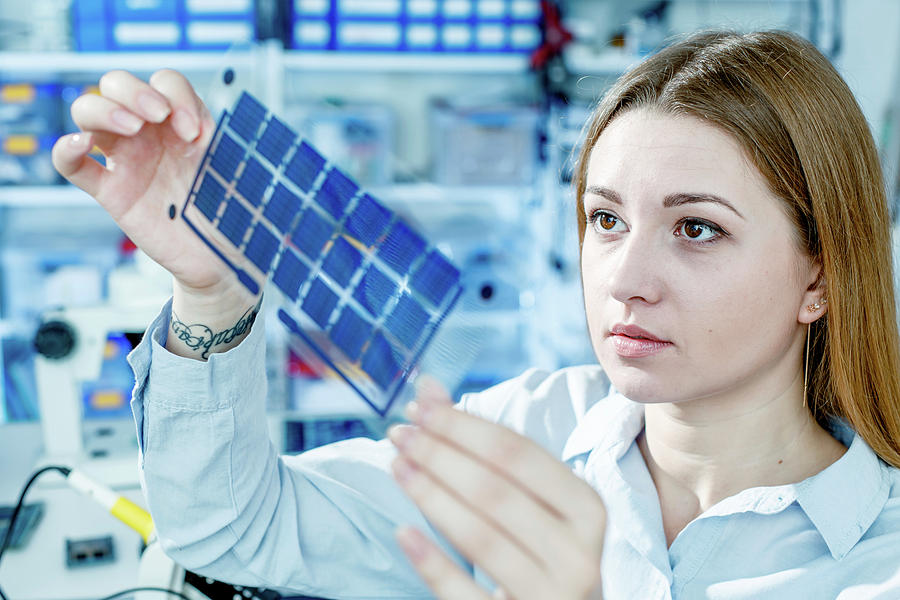 Girl Holding Film Solar Cells Photograph by Wladimir Bulgar/science Photo Library