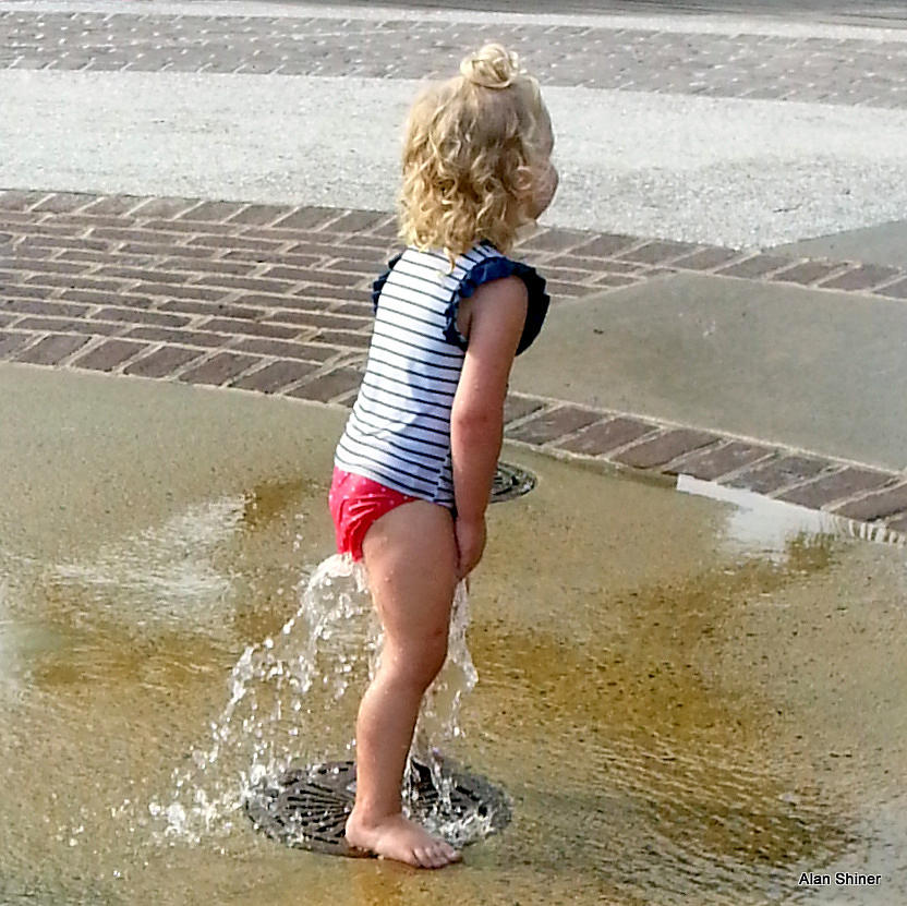 Girl In Fountain Photograph by Alan Shiner