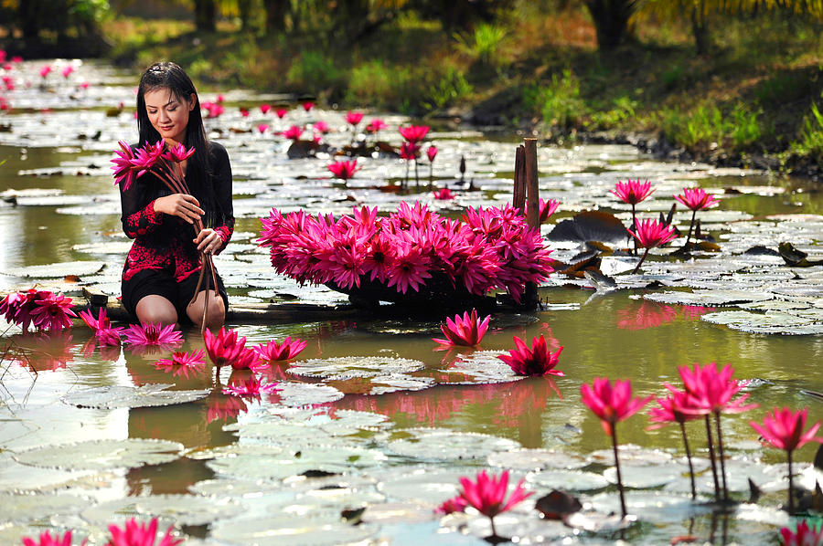 Girl in lotus pond Photograph by Dung Ma