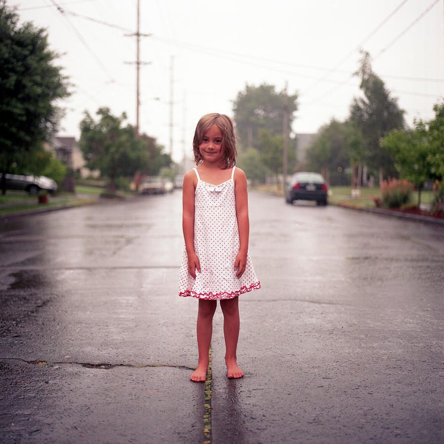 Girl In Rainy Street Photograph by By John Carleton