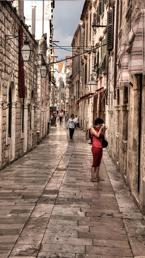 Girl in red in the White Streets of Dubrovnik Photograph by Weston Westmoreland