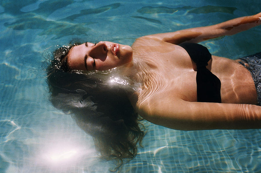 Girl in Swimming Pool Photograph by Hollie Fernando