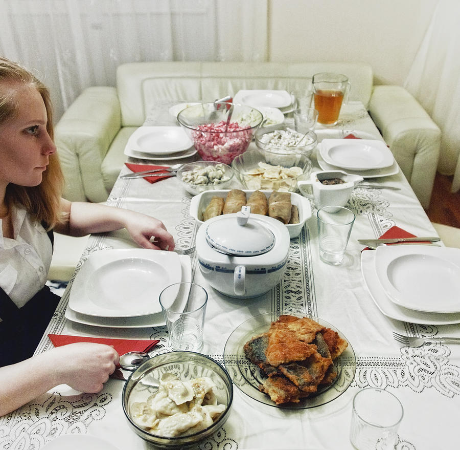 Girl infront of traditional polish christmas dinne Photograph by Pawel Wewiorski