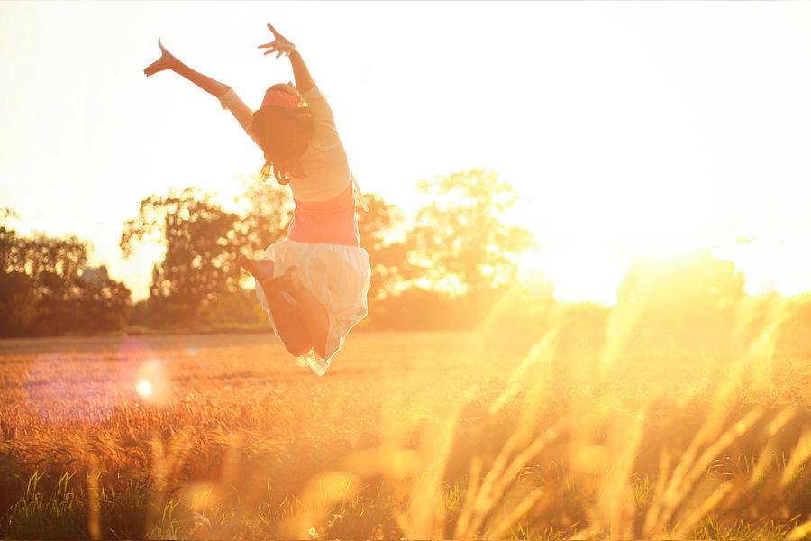 Girl jumping into the sunshine Photograph by Olivia Bell Photography