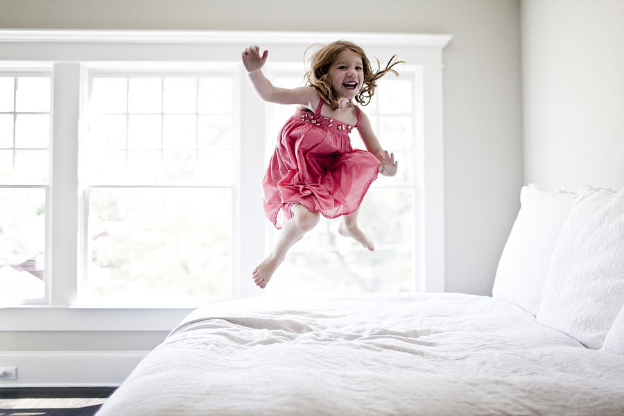 Girl Jumping On Bed Photograph by G&l Images