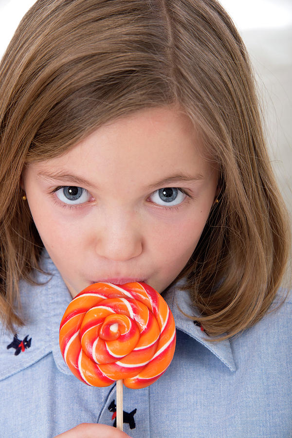Girl Licking A Lollypop Photograph By Lea Paterson