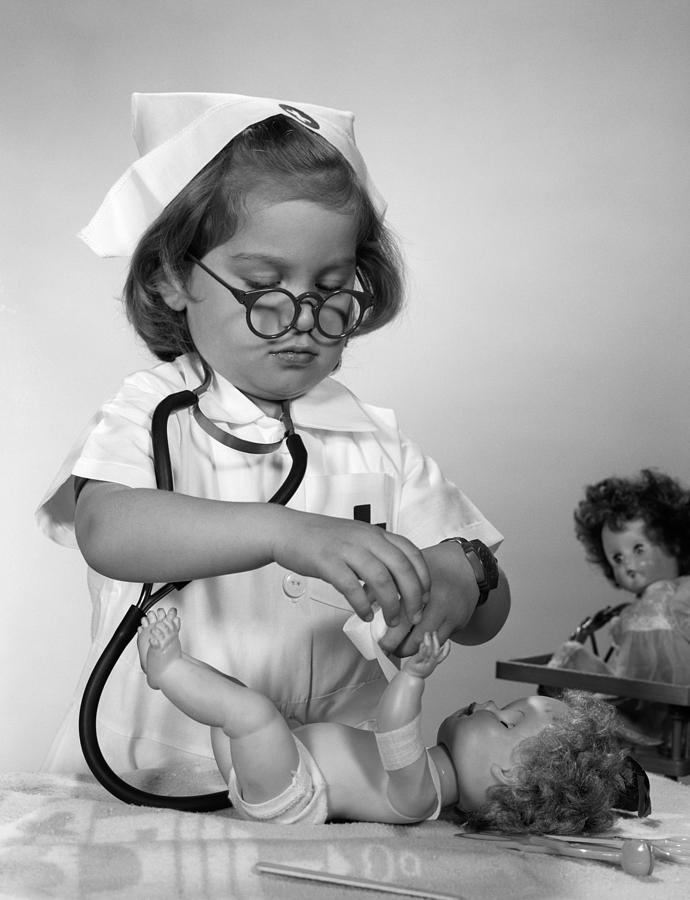 Girl Playing Doctor, C.1950-60s Photograph by H. Armstrong Roberts/ClassicStock