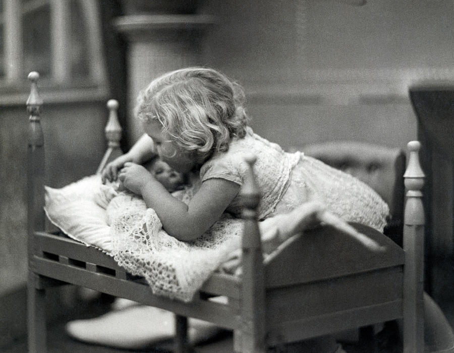 Girl Puts Doll To Bed Photograph by Underwood Archives