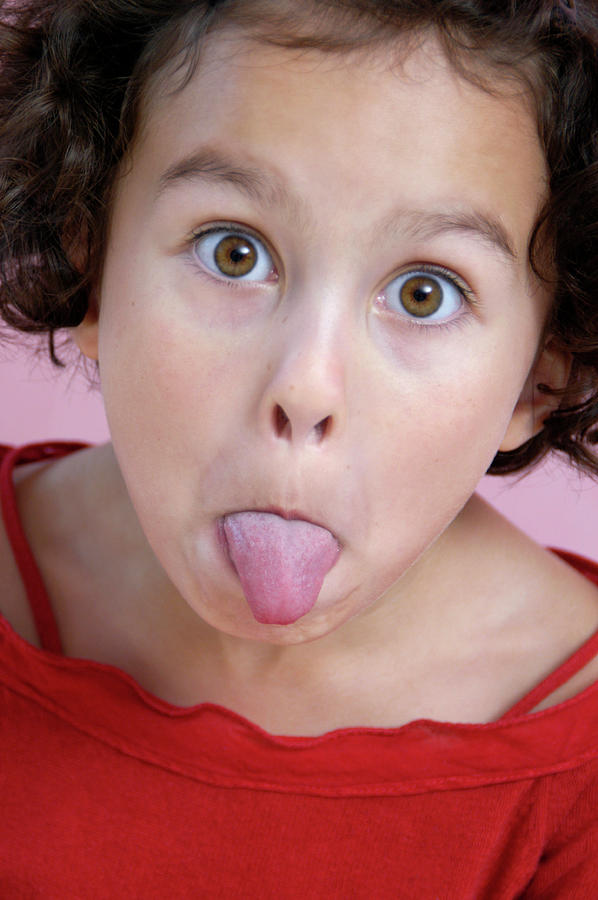 Girl Sticking Out Her Tongue Photograph by Aj Photo/science Photo Library