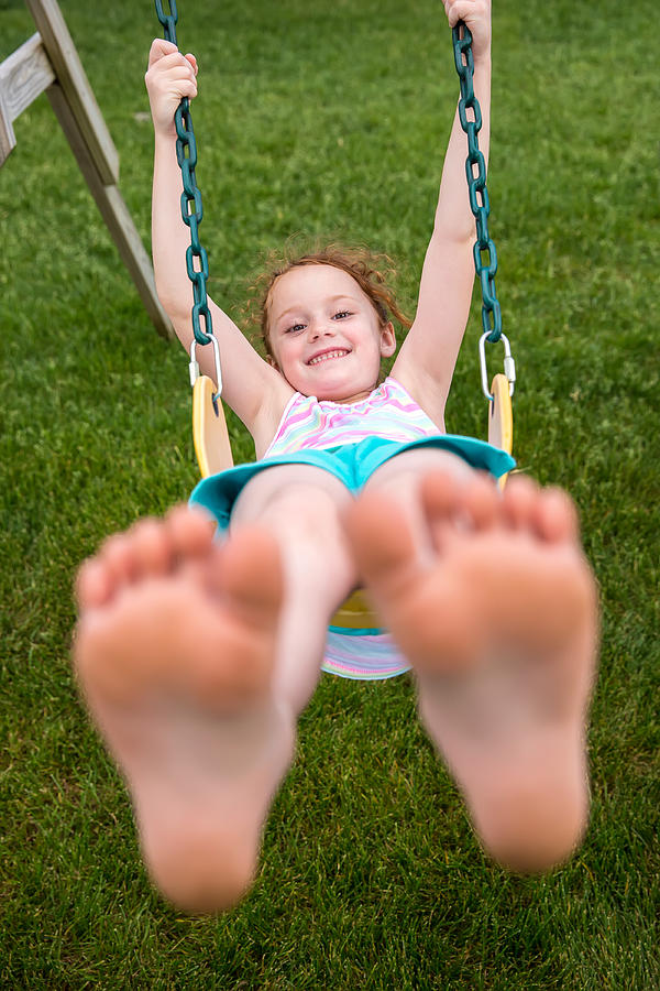Girl Swinging on Swing Photograph by Emholk