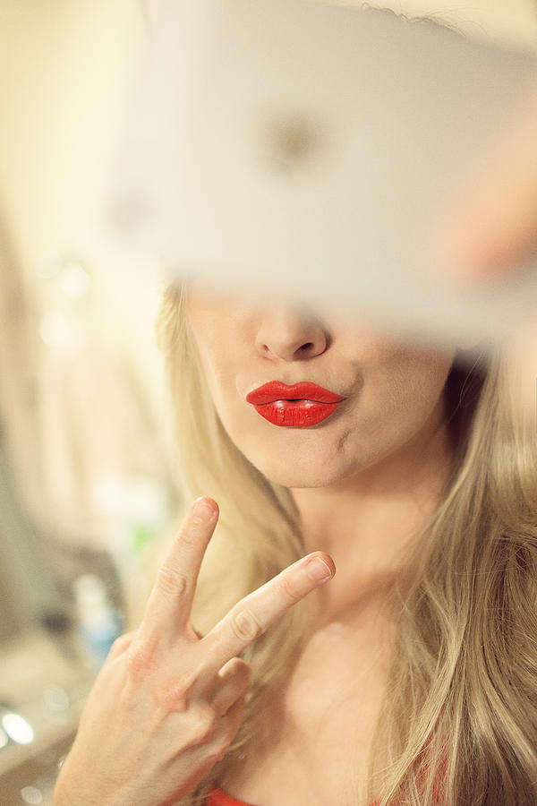 Girl takes a selfie with a duck face Photograph by Samantha T. Photography