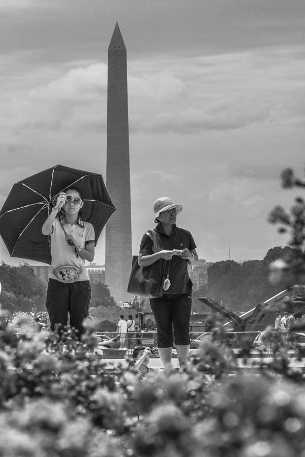 Girl taking a photo with Washington Monument in Background  Photograph by John McGraw