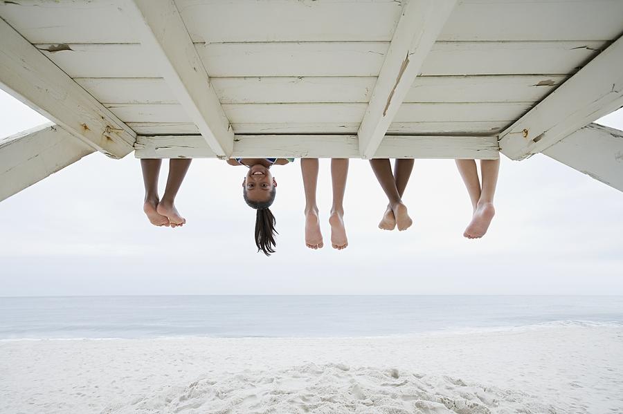 Girl upside down Photograph by Image Source