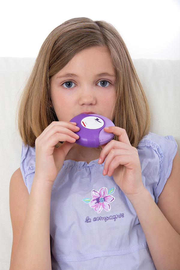 Female Photograph - Girl Using Asthma Medication by Lea Paterson
