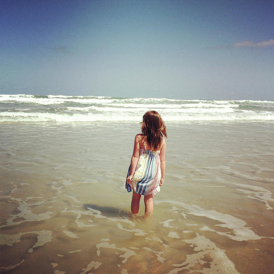 Girl Wading In Ocean Photograph by Cyndi Monaghan