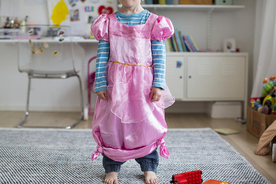 Girl wearing fancy pink dress Photograph by Johner Images