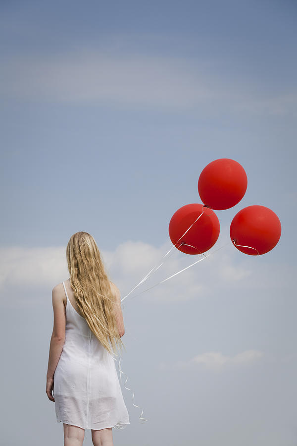 Girl with red balloons Photograph by Maria Heyens