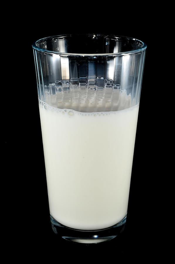 Glass Of Milk On Black Background Photograph