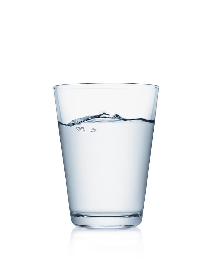 Glass of water isolated on white Photograph by Kedsanee