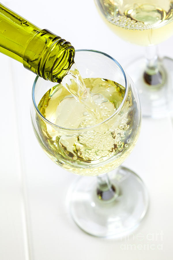 Glass Of White Wine Being Poured Photograph
