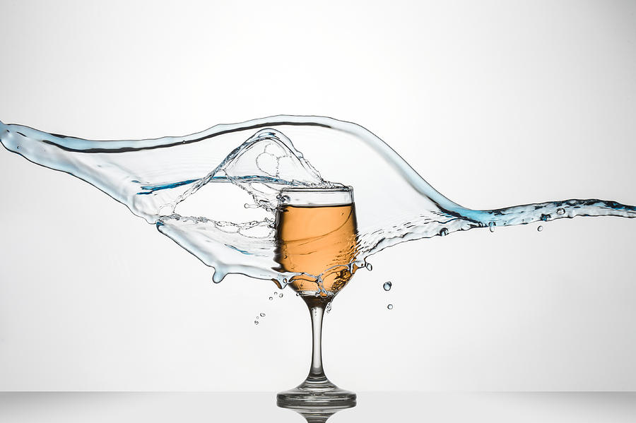 Abstract Photograph - Glass of White Wine with splash. by Andy Astbury