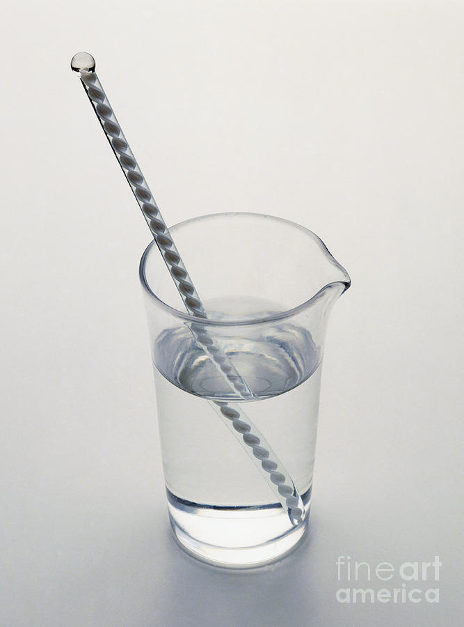 Still Life Photograph - Glass Rod Refracted In Water by Dave King / Dorling Kindersley