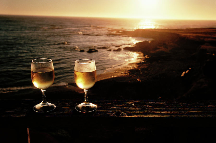 Glasses Of White Wine Beside A Beach Photograph by Peter Menzel/science Photo Library