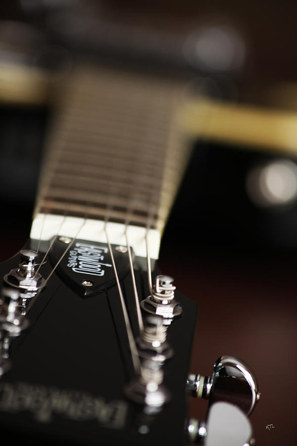 Glimpse Of A Guitar Photograph by Karol Livote