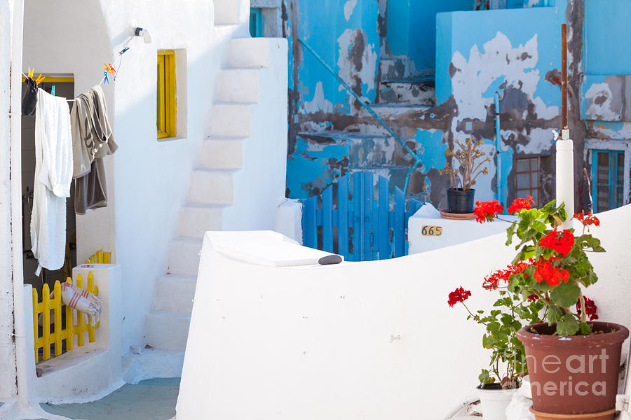 Glimpse of typical white houses in Oia Santorini Greece Photograph by Matteo Colombo
