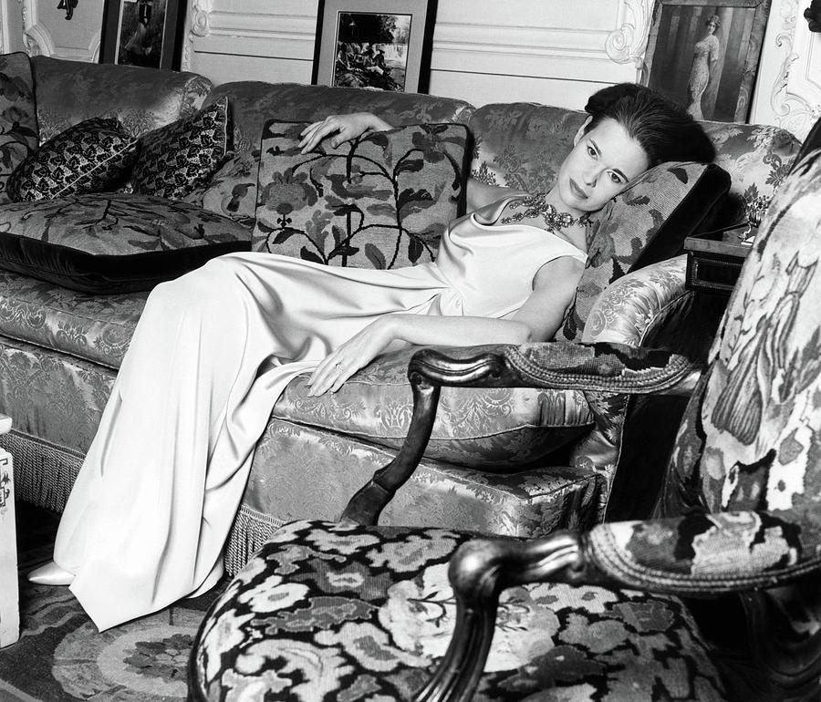 Gloria Vanderbilt Reclining On A Couch Photograph by Horst P. Horst