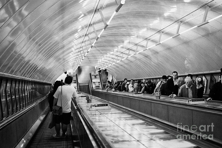 London Photograph - going down steep down escalator in tube station London England UK by Joe Fox