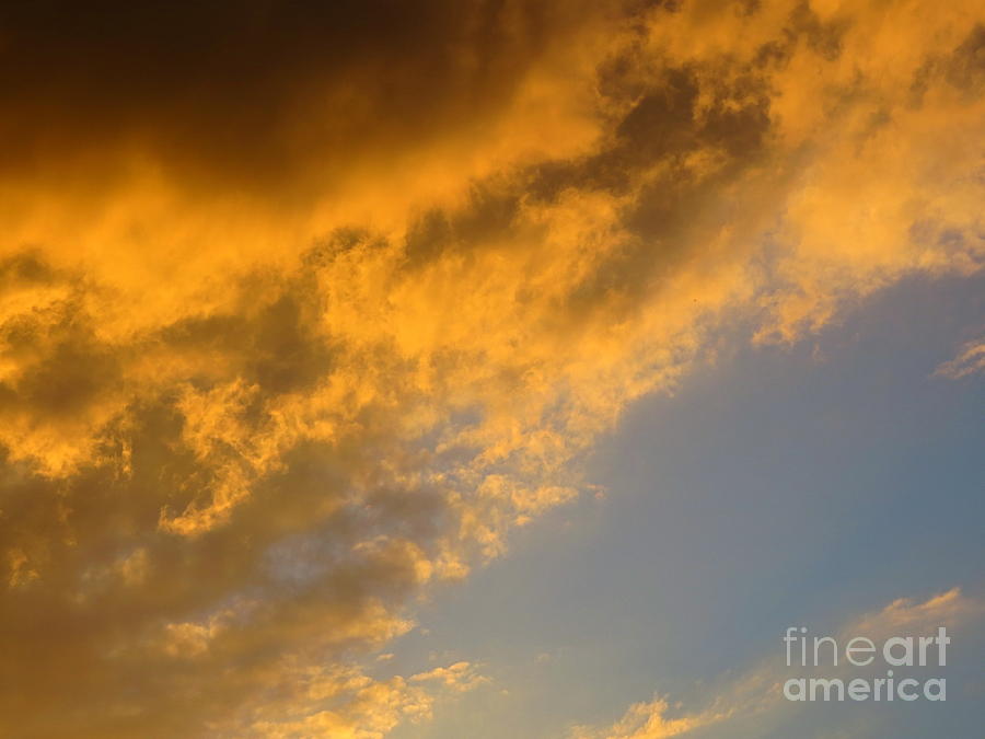 Golden Clouds at Sunset. Photograph by Robert Birkenes