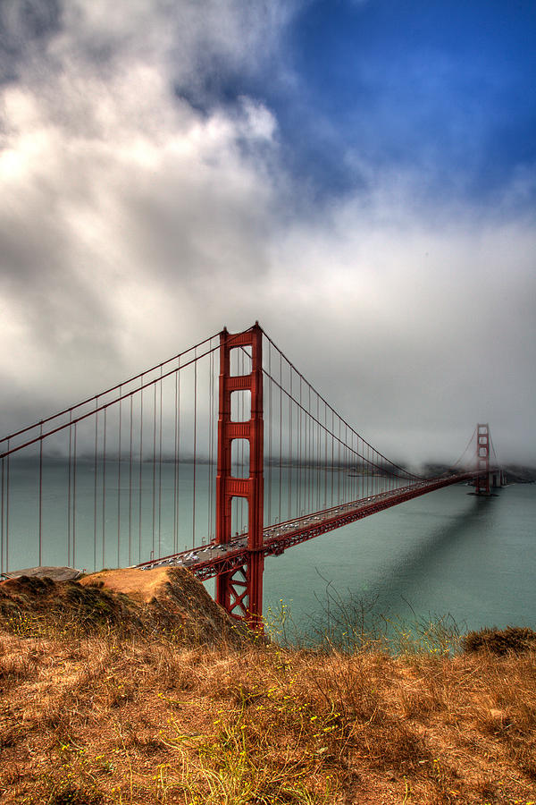 Golden Gate Bridge Photograph - Golden Gate in The clouds by Peter Tellone