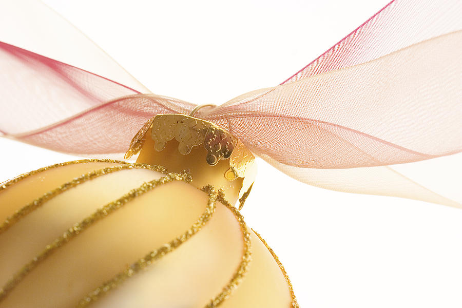Golden Ornament with Red Ribbon High Key Photograph by Carol Leigh
