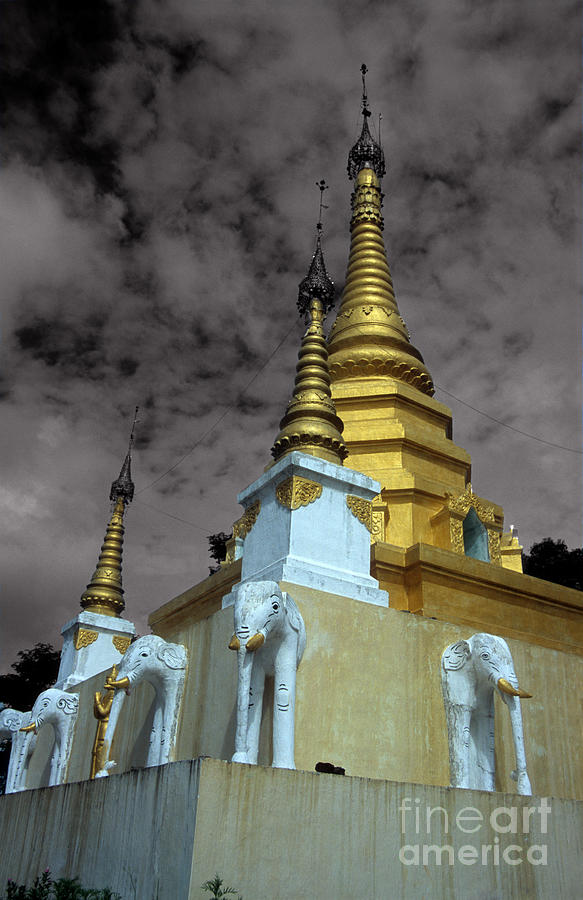 Elephant Photograph - Golden spires of Burmese Buddhist Temple near Ruili by James Brunker