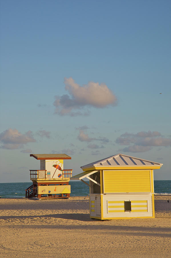 Golden Sun Hitting Beach Structures And Photograph by Barry Winiker