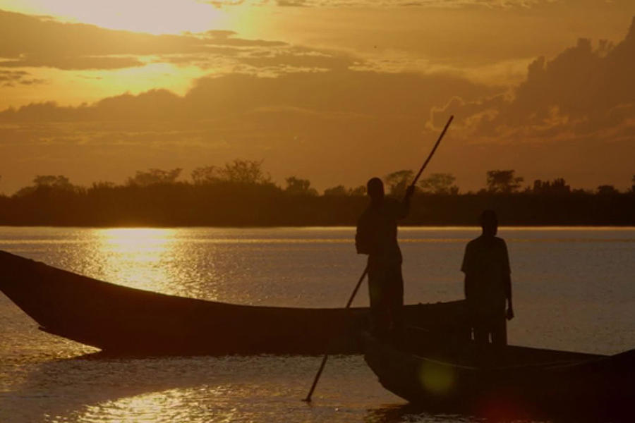 Boat Mixed Media - Golden sunset two fishermen enjoy the evening after days  hardwork by Navin Joshi