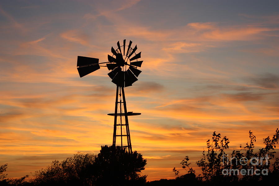 golden windmill silhouette photograph by robert d brozek