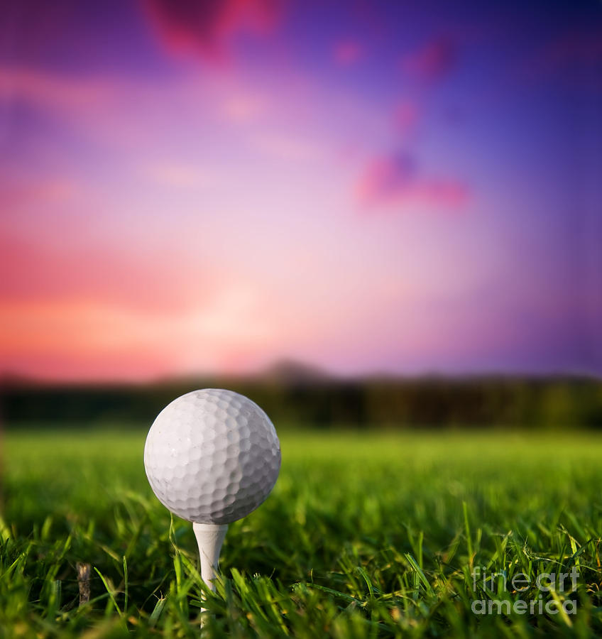 Sports Photograph - Golf ball on tee at sunset by Michal Bednarek