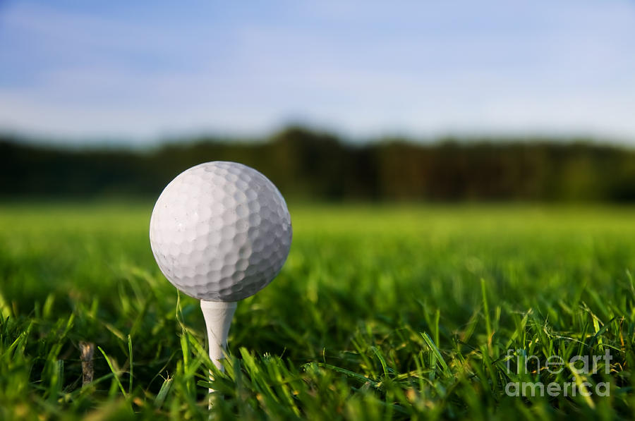 Golf ball on tee Photograph by Michal Bednarek